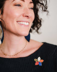 Épinglette en émail - Fleur de la Continuité